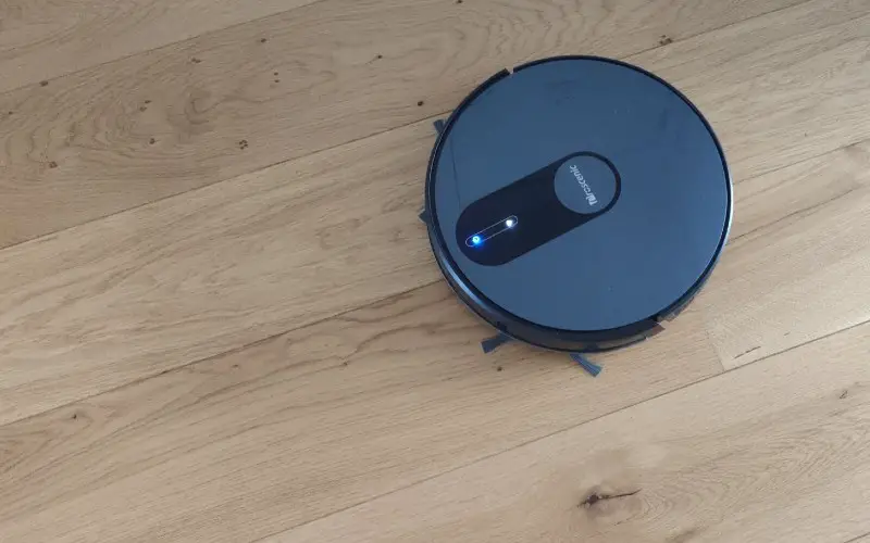 The Proscenic 820s vacuuming on a wooden floor