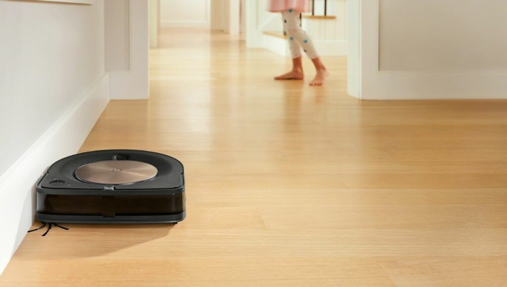The iRobot S9+ cleaning right up the the edge of the floor thanks to the new D shape.