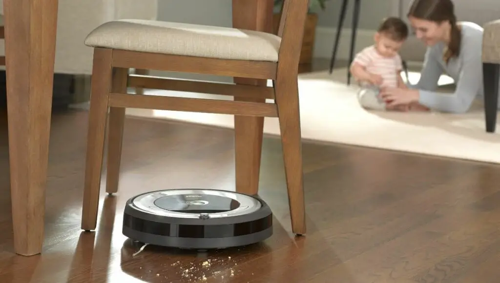 iRobot Roomba 690 working on a wooden floor