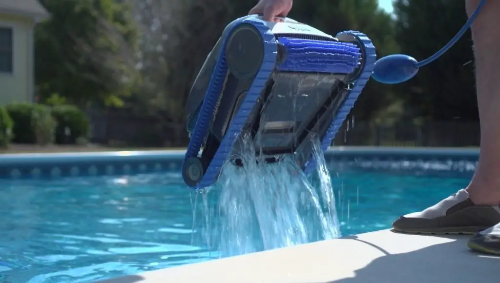 Swimming pool cleaner robot during vacuum service, maintenance.