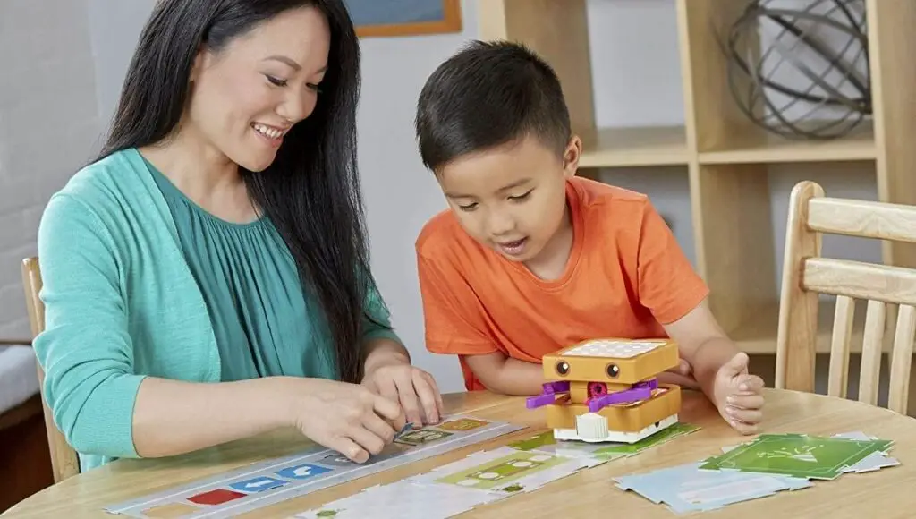 Mother and her son playing with great coding gift