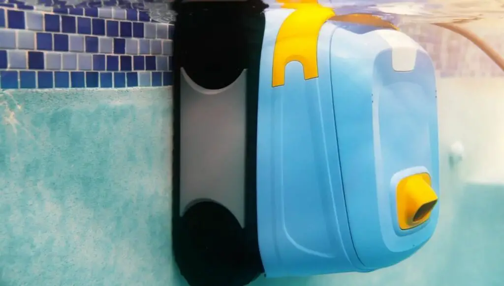 An aqua product evo 502 robotic pool cleaner cleaning the walls of the swimming pool