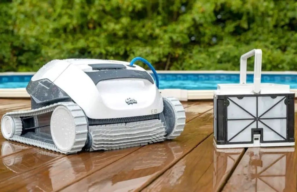 The Dolphin E10 on a wooden deck, one of the best robotic pool cleaners under $500