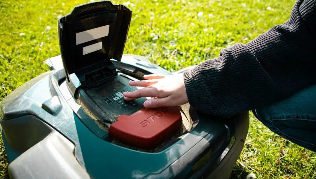 A lady set up a robot lawn mowers navigation system