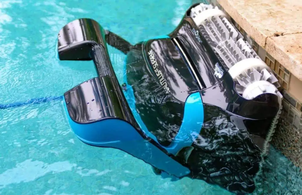 The Dolphin Nautilus Supreme robotic pool cleaner cleaning the waterline of a swimming pool.