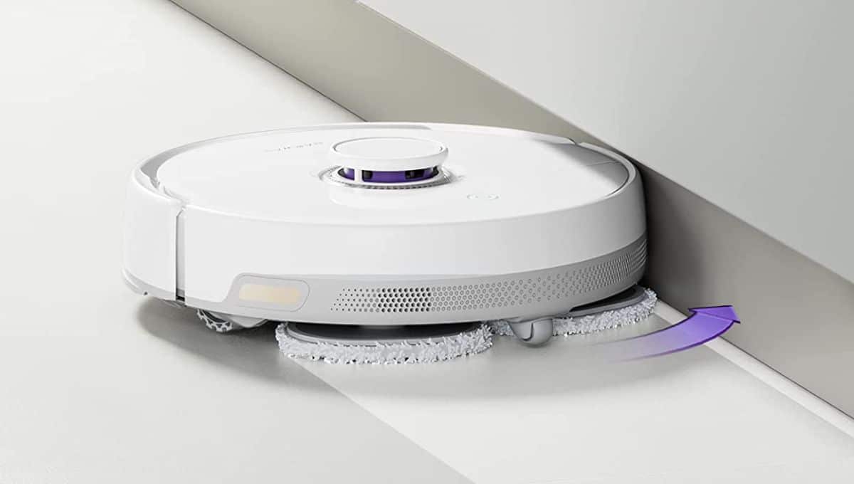 A Narwal Freo robot vacuum and mop doing deep cleaning in walls corners and floor