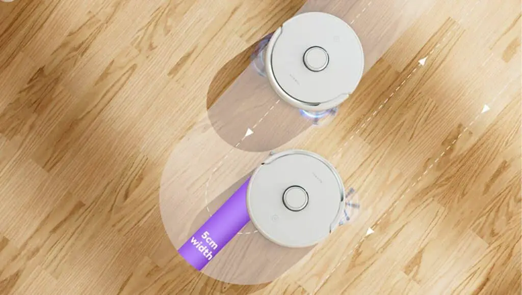 Two narwal freo robot vacuum on wood floor vacuuming together