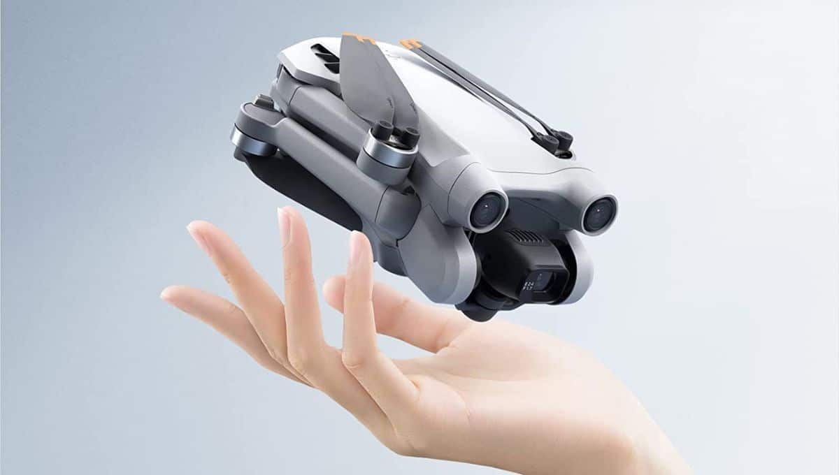 dji mini 3 pro drone on a beautiful lady's hand