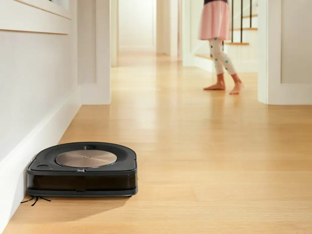 The Roomba S9 cleaning close to the wall