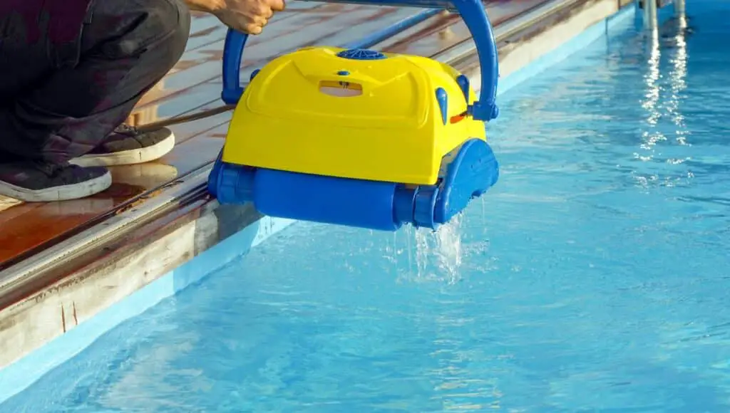 a robotic pool cleaner removed from water