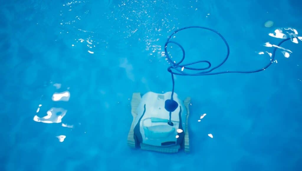 a robotic pool cleaner in a pool